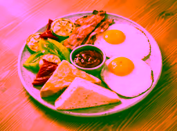 Fried eggs with bacon and vegetables